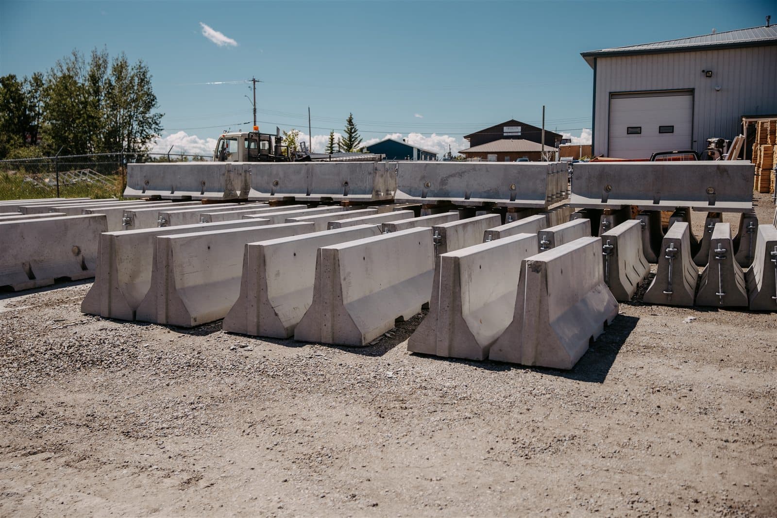 Precast concrete Jersey barriers staged in the AltaMix yard.
