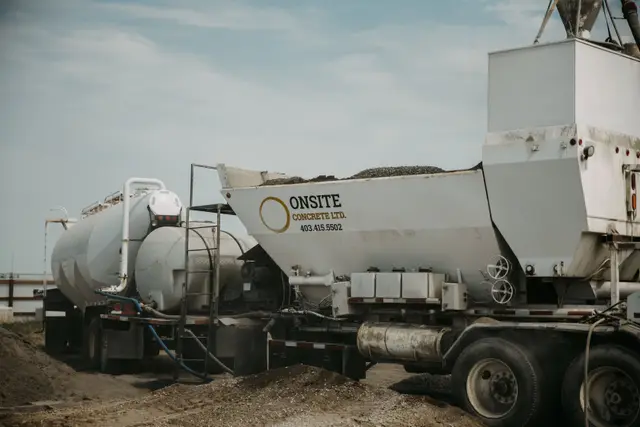 Onsite Concrete Ltd branded pugmill mix truck parked at the yard, clean well-lit detail shot.